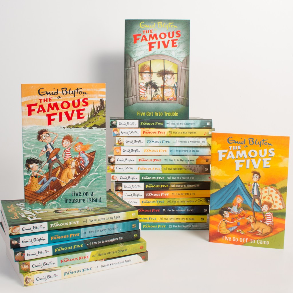 Famous Five books stacked on a white background